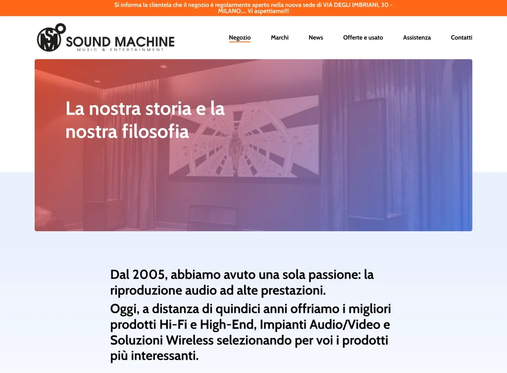 Negozio page before the restyling — bright hero with red-blue duotone photo